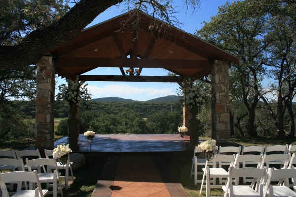 The Bride and Groom were married under an outdoor arbor overlooking the 